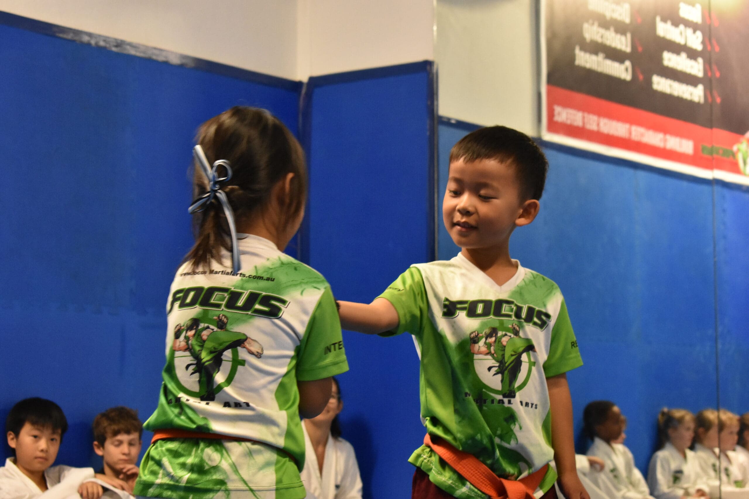 Preschool martial arts programs provide children with self-defence training that promotes self-control, physical fitness, and self-confidence through fun and structured sessions. With professional, qualified coaches guiding classes in Brazilian Jiu-Jitsu and other martial arts styles, children develop essential defence techniques, improve social skills, and build self-esteem while learning to recognize potential threats and respond to potentially dangerous situations. These programs offer a whole-body workout that encourages individual and personal growth, problem-solving skills, and overall well-being through regular practice and a better understanding of real-world challenges—all within a supportive school-based environment.