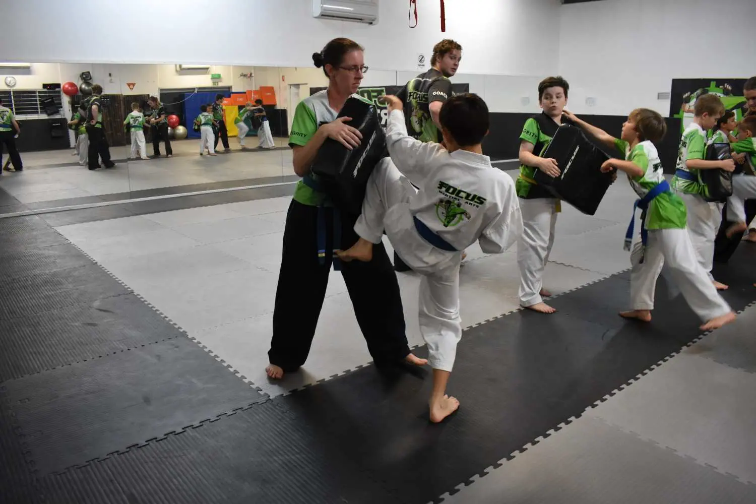 kids martial arts class demonstrating discipline and focus