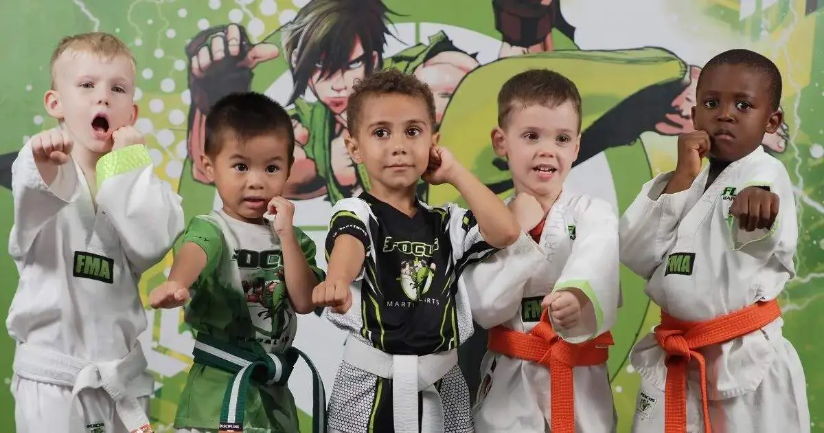 Young children posing in fighting stances during a Brazilian jiu jitsu kids training session