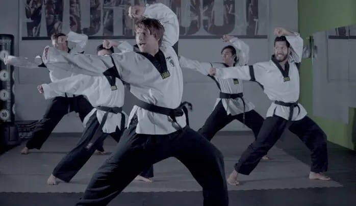 students practicing taekwondo stances for adult taekwondo classes
