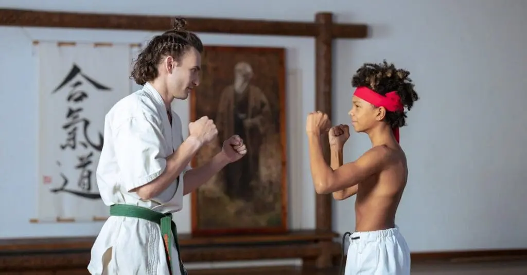 Instructor coaching student in guard stance for karate fundamentals