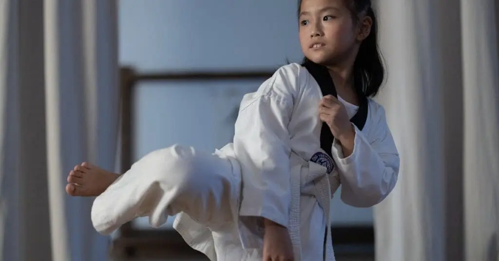 Beginner student practicing kicks in taekwondo training guide for beginners exercises