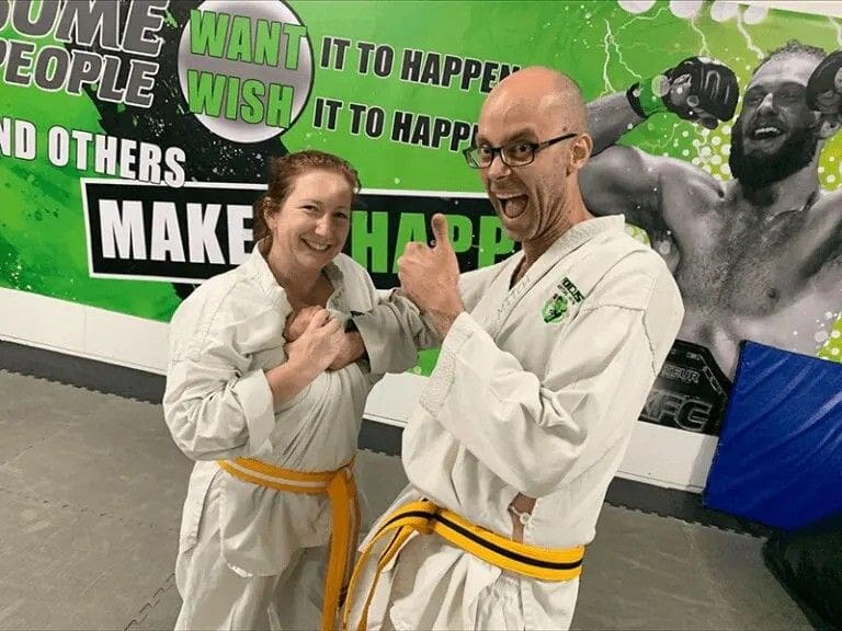 student showing confidence at an adult karate class