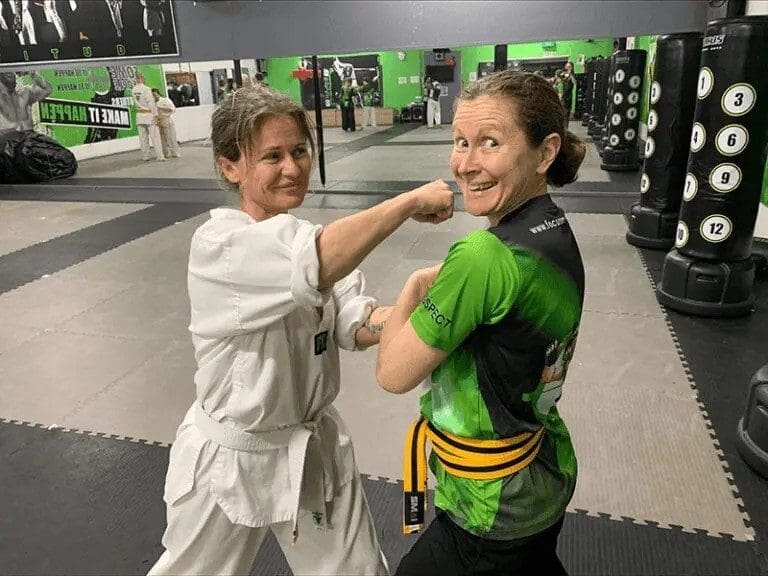 students practicing drills with adult karate classes
